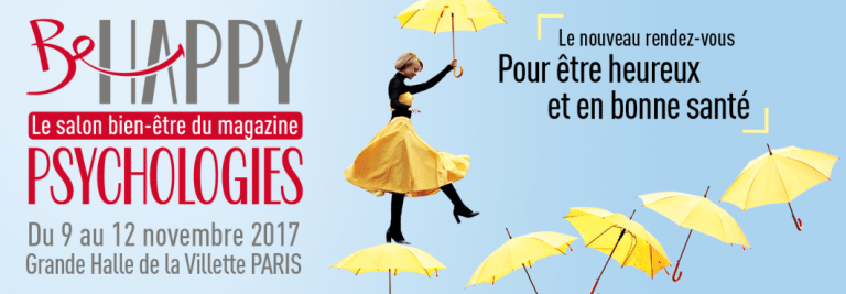 Une femme en robe jaune saute joyeusement parmi des parapluies jaunes flottants. Le texte promeut Be Happy, un salon du bien-être par Psychologies magazine, 9-12 novembre 2017, Paris-célébrant le bonheur et la santé avec des ateliers de Gestalt de l'École Humaniste de Gestalt.